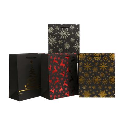 China Recyclable Custom Hot Stamping Paper Bag LOGO Pattern Paper Gold Foil Shopping Packaging Christmas Packaging For Clothing Jewelry Party for sale