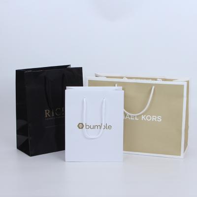 China Recyclable Manufacturers Wholesale Card Clothing Shopping Paper Bag Custom White Hand Held Paper Gift Bag for sale