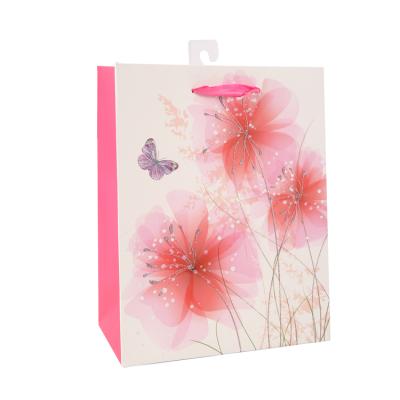 China Recyclable Luxury Cute Flower Pattern Printing Butterfly Color Paper Bag Gift Bags With Stronger Handle For Shopping Clothing for sale