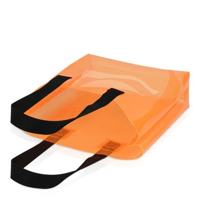 China Reusable Customized Women Fashion PVC Translucent Orange Handbag Beach Bag Jelly Color Waterproof Shopping Bag for sale