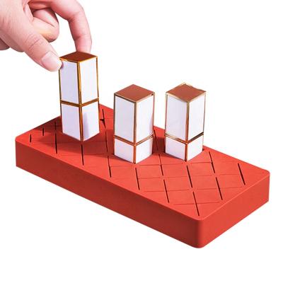 China Eye Catching 24 Slots Lip Gloss Display Stand Lipstick Organizer Silicone Lip Gloss Holders for sale