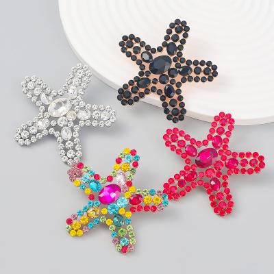 China Famous Diamond-studded Hyperbole Starfish Alloy Diamond-studded Earrings Summer Beach Wind Resistant Earrings for sale