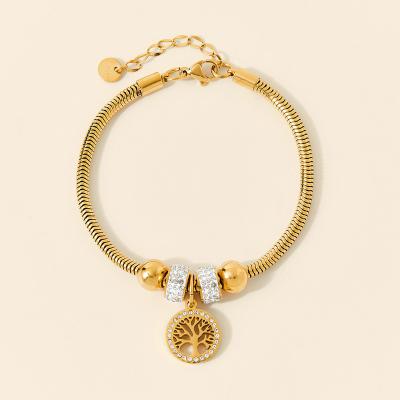 China TRENDY Gold Plated Hollow Tree Stainless Steel Crystal Small Bead Charm Bracelet 316l Snake Bone 18k Life Charm Bracelet for sale