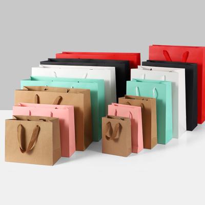 China Recycled Materials Gift Bag With Custom Logo Kraft Paper Bag Custom Mailing Bags For Clothes for sale