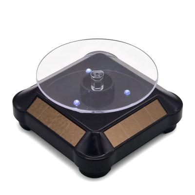 China Rotate 360 ​​Degree 360 ​​Degree White LED Light Rotating Display Stand Battery Or Solar Powered Turntable for sale