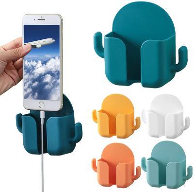 China USLION Adjustable Plastic Wall Cell Phone Stand Holder Mobile Phone Accessories Wall Mount Home Boxed Storage Bracket for sale