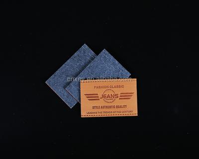 China Sustainable PU Jeans Leather Label Apparel Main Label for sale