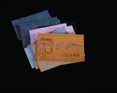 China Sustainable Custom Apparel Label Jeans PU Leather Label for sale