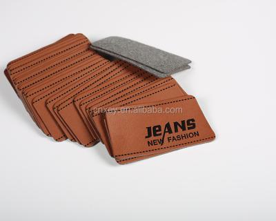 China Sustainable PU Leather Label Apparel Main Label Jeans Label for sale