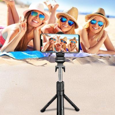 China Folding Mini Portable Flexible Expandable 3 in 1 Controller XT09 Wireless Remote Shutter Tripod Selfie Stick for Smartphone for sale