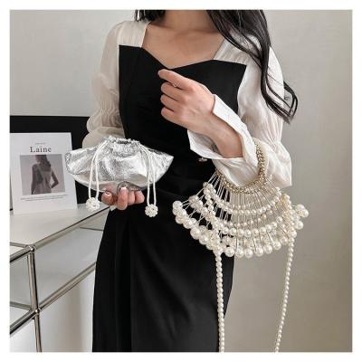 China Fashion Cavity Woven Helix Shaped Fashionable Metal Bead Beach Niche Dinner Shell Clutch Evening Party For Women for sale