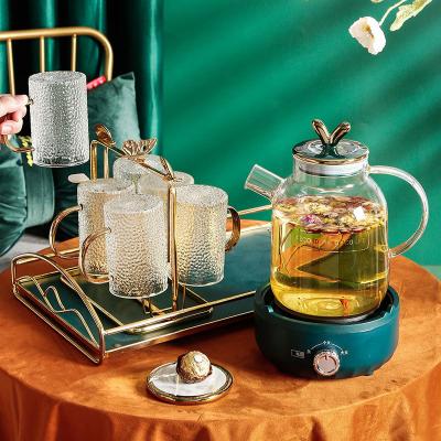 China Sustainable Nordic Electric Heating Stove Household Teapot Flower Wind INS Ceramic Glass Cup Holder for sale