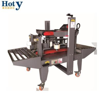 China Top quality HOT SALE semi-automatic CLOTHING top&bottom belt drive and two side carton sealer for sale