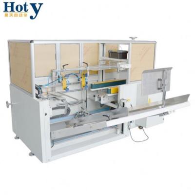 China CLOTHING Up and Down Box Fold Tapping Packaging Machine for Cardboard Boxes for sale