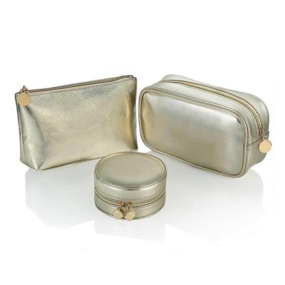 China Feature Gold Leather Metallic Pouch Personalized Mini Bags For Lady Makeup Pouch Cosmetic Bag for sale