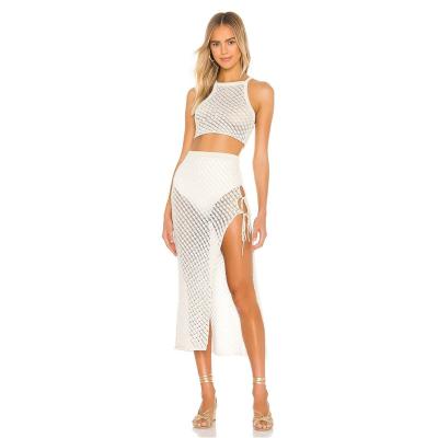 China 2021 QUICK DRY new arrives white crop tank top and long hollow-out skirt summer knitted set for beach for sale