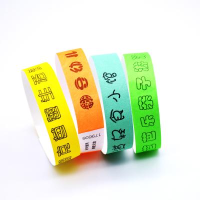 China Cheap Festival Decoration Tyvek Wristbands 1000pcs Per Bag Orange Paper Wristbands Colored Paper Wristbands For Events for sale