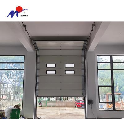 China Heat Insulation Steel Panel Solid Sectional Industrial Lifting Door Design for sale