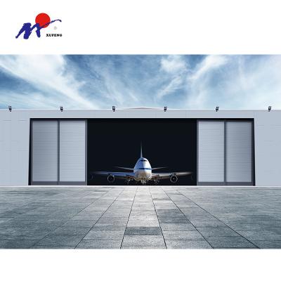 China Large Modern Factory Side Revolving Sliding Automatic Aircraft Manufacturers Hangar Sectional Door for sale