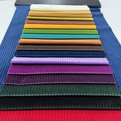 China Waterproof Chinese Multi Colors Ribbed Solid Velvet Corduroy Fabric For Clothes Sofa Home Garment Textile for sale