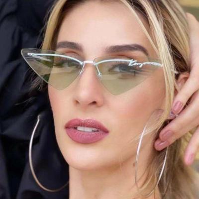 China Anti PC UV400 Lmamba Personality Cat Eye Small Frame Sun Glass Frameless Women Shape Fashionable Modern Sunglasses for sale