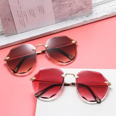 China Fashionable Luxury Hot Selling UV400 Street Beat Sunglasses Women Rimless Cut-Edge Sun Glass Shades for sale