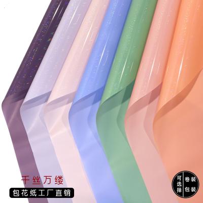 China Anticurl Film Waterproof Colorful Flower Laser Hot Selling Kraft Paper Wrapping Paper for sale