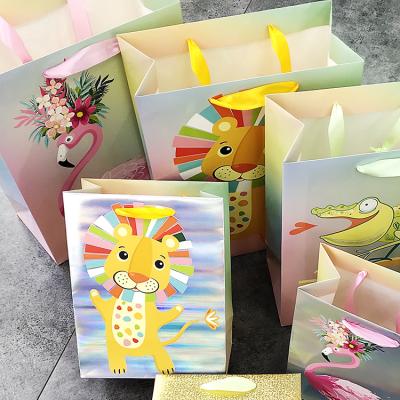 China Recyclable Wholesale Cartoon Pattern White Paper Shopping Bag For Kid Gift for sale