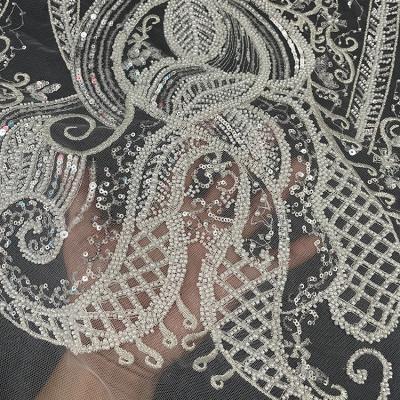 China Elastic Embroidery Tulle Wedding Dress Beaded Lace Fabric Bridal Laces With Sequins for sale