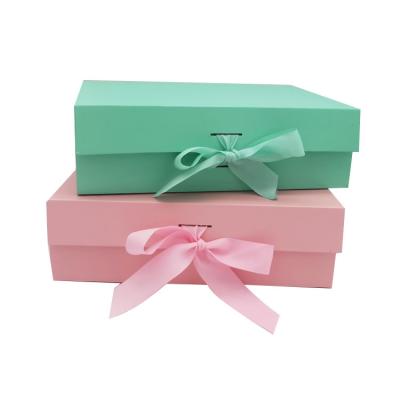 China Recycled Private Packaging Design Materials Cardboard Box Paper Cardboard Magnetic Folding Foldable Gift Storage Boxes With Ribbon for sale