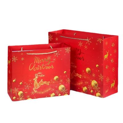 China Recyclable 2021 New Christmas Gift Bag Paper Bag White Paper Christmas Eve Red Gift Bags for sale