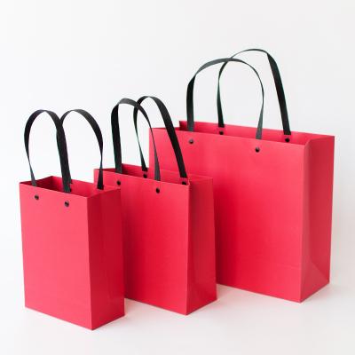 China Business Recyclable Gift Box Red Rivet Bag Set Apparel Gift Box Wedding Paper Bag Party Packing Box for sale