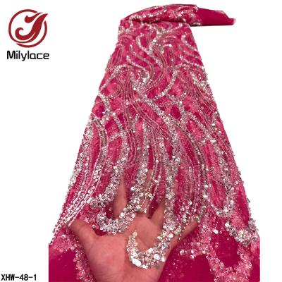 China Sustainable Luxury Beaded Dress Tulle Lace Fabric Crystal Sequin Hand Beaded Lace Fabric Wedding for sale