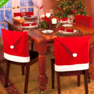 China 2021 Wholesale Promotional Cheap Nonwoven Fabric Santa Red Hat Chair Back Cover Xmas Christmas Chair Cover for sale