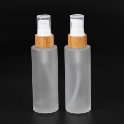 China Empty Sets Chemical Glass Frosted Lotion Bottle With Bamboo Lid For Cosmetic Toner Lotion Packaging for sale