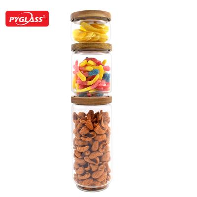 China Sustainable New Trend Small Wide Mouth Storage Round Food Clear Borosilicate Glass Jar With Bamboo Lid for sale