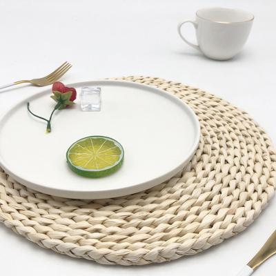 China Cheapest Wholesale Handmade Natural Round Place Mat Rattan Water Hyacinth Placemat Sustainable for sale