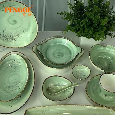 China Sustainable New Design Unique Light Green Unique Cutlery Set Brown Spots Reactive Stoneware Wedding Party Home Cutlery Dinner Set for sale