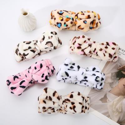 China Wholesale Cute Soft Spa Facial Headband Soft Fleece Bow Leopard Bow Yoga Makeup Elastic Hairband Cosmetic Elastic Headband For Girl Woman for sale