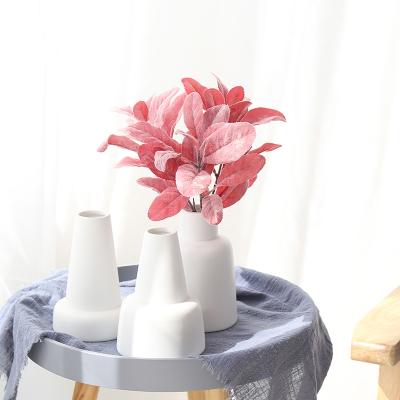 China (1300 degree) hot sale special shape porcelain design porcelain high temperature fired flower vases decoration ceramic wedding for sale