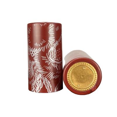 China Manufacturer Printed Oxblood Red Thermal Shrink Fast Delivery Plastic Cap Wine Bottle Caps for sale