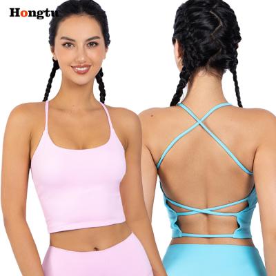 China Manufacturer Breathable Custom Logo XS - XL Sporty Yoga Tops Padded Open Back Cross Back Bra for sale