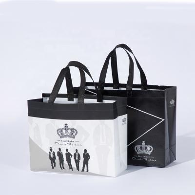 China Custom logo printed large foldable non woven shopping bag wholesale BIODEGRADABLE reusable fabric packaging storage packing bag for sale