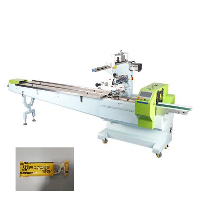 China Automatic Food Pillow Plastic Film Packaging Machine Glasses Flow Packing Machine for sale