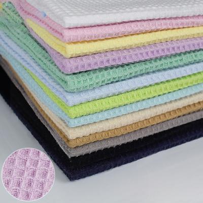 China Best Selling 100% Organic Cotton Waffle Fabric Honeycomb Woven Waffle Fabric Baby Textile Blanket Pineapple Lattice Home Fabric for sale