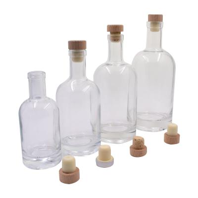 China High Quality Viable Custom Capacity Empty Clear Round Glass Bottle Flint Liquor Wine Whiskey Vodka Tequila Bottle With Cork Sealed Lid for sale