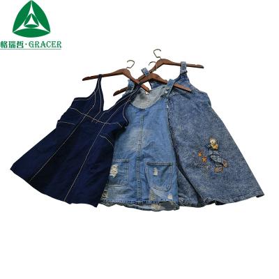 China Package wholesale used clothes in the ball girl denim strap dress and women's clothing jeans skirt for sale