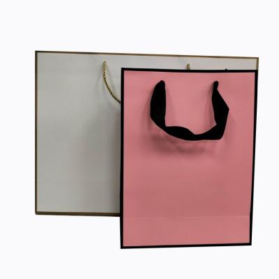 China Recycled Materials Custom Paper Shopping Bag with Ribbon Art Paper Shopping Personalized Gift Bags for Clothes / Clothing for sale