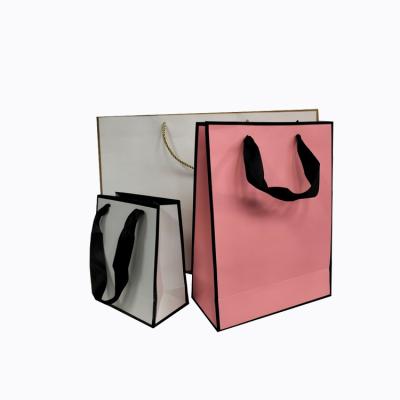 China Custom Made Reused Materials Shopping Bag The Logo Printed Luxury Personalized Paper Shopping Bag with Handles for sale