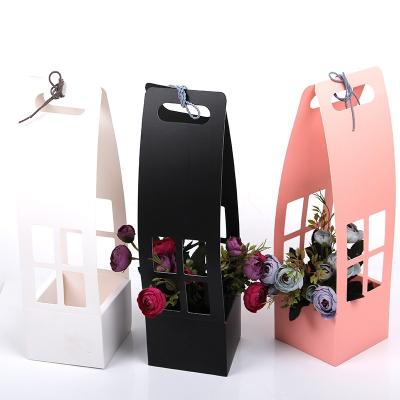 China Recycled Paper Packaging Materials Hollow Flower Basket Mother's Day Flower Gift Folding Waterproof Handheld Box for sale